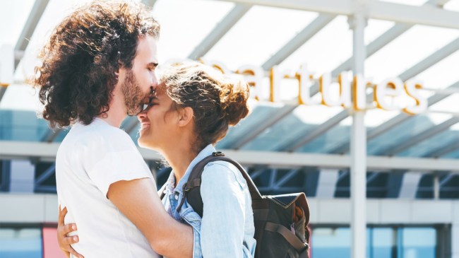 couple hugging at the airport