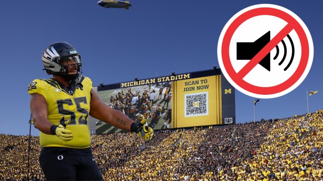 Oregon defender Derrick Harmon pictured over a background of Michigan Stadium.