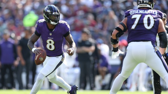 Lamar Jackson scrambles from the Washington Commanders defense.