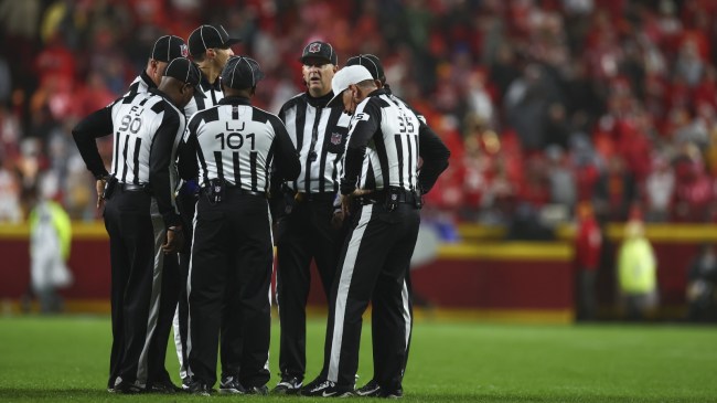 NFL refs huddle during a game between the Chiefs and Bucs.