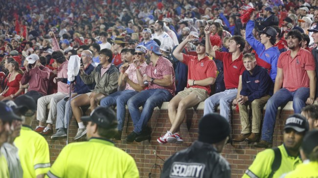 Ole Miss football fans prepare to storm the field during a win over Georgia.