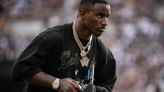 Deion Sanders Jr on the sidelines during a football game between Colorado and UCF.