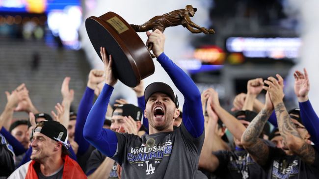 freddie freeman holding world series MVP trophy