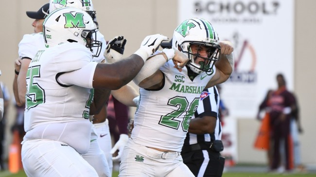 Marshall football players celebrate a touchdown vs. Virginia Tech.