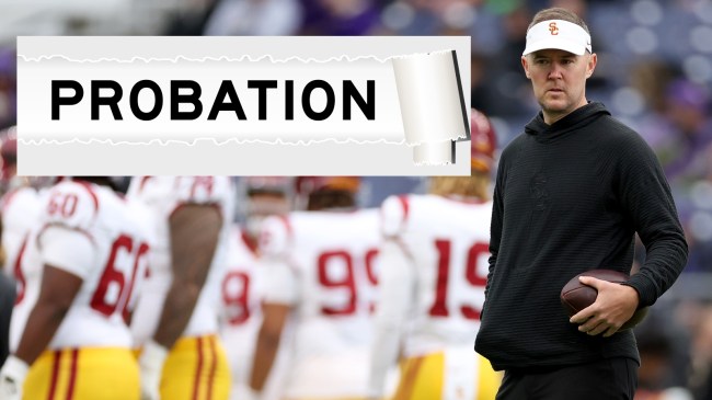 USC football coach Lincoln Riley on the field before a game.