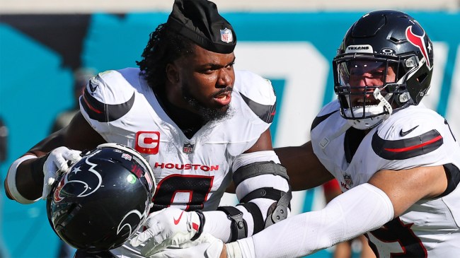 Azeez Al-Shaair takes off his helmet before fight against Jacksonville Jaguars