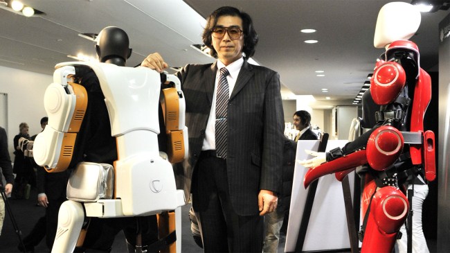 Cyberdyne president Yoshiyuki Sankai displays full-body type HAL (Hybrid Assistive Limb) robotic exoskeleton