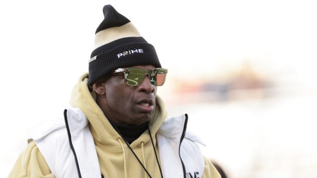 Colorado football coach Deion Sanders on the field.