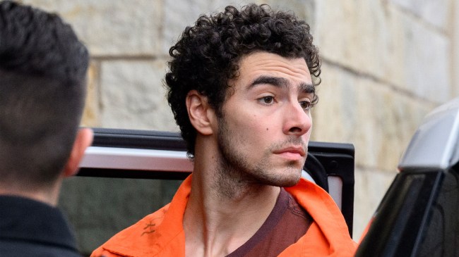 Luigi Mangione is led into the Blair County Courthouse