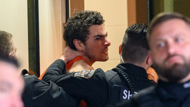 Luigi Mangione is led into the Blair County Courthouse for an extradition hearing