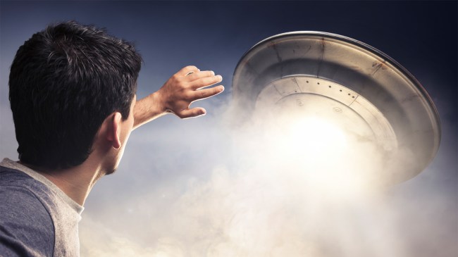 Man about to be abducted by aliens in UFO