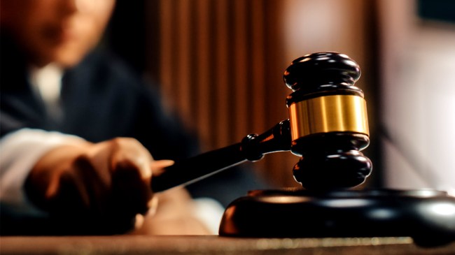 Trial in Session Female Judge striking Gavel prison