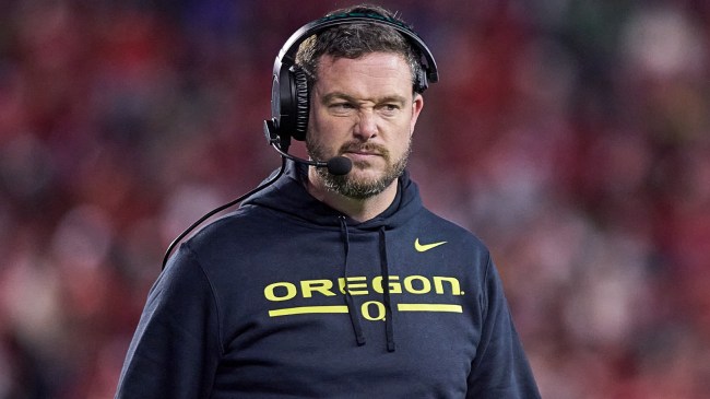 Oregon football coach Dan Lanning on the field.