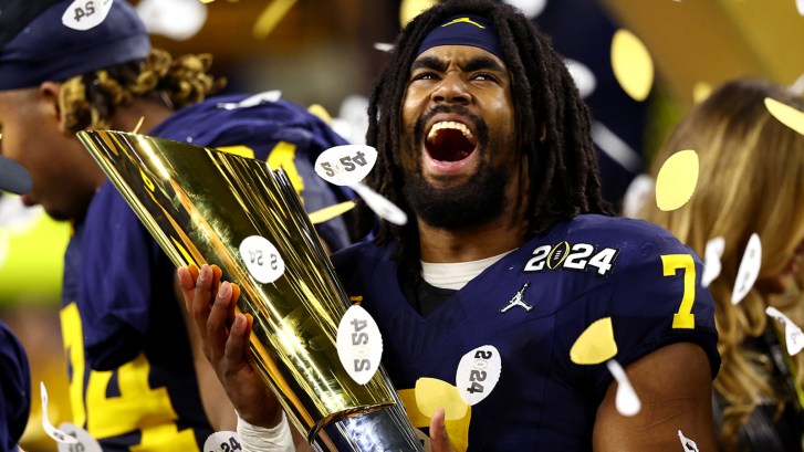 Donovan Edward holding national championship trophy