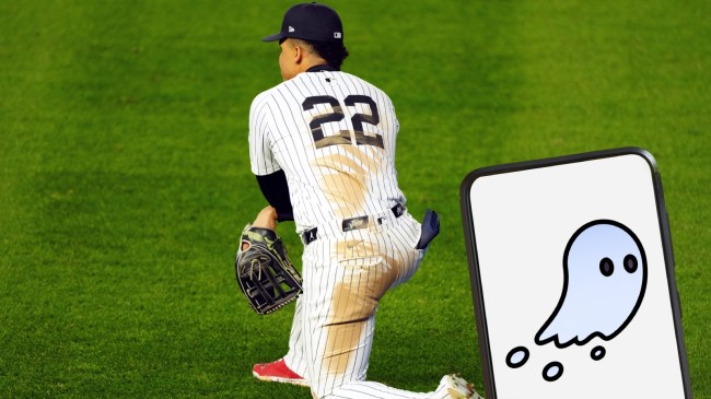 Yankees outfielder Juan Soto kneels on the field.