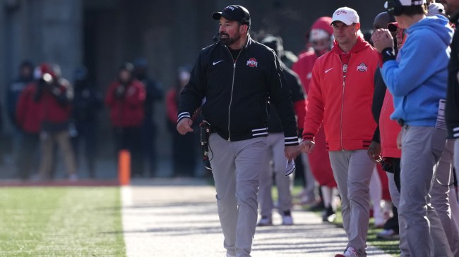 Ohio State football coach Ryan Day walks the sidelines.