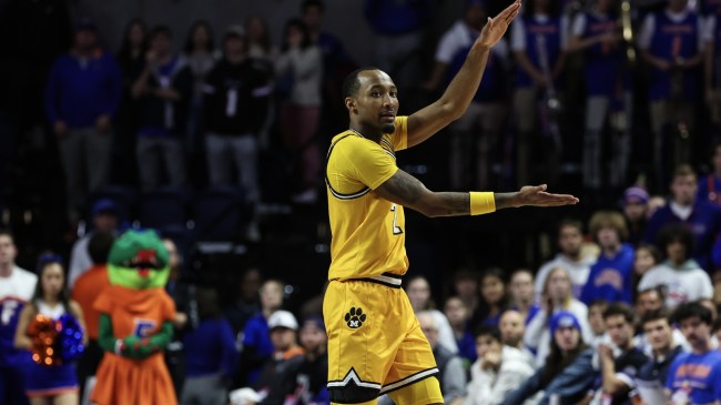 A Missouri basketball player gestures to the home crowd after a win over the Florida Gators.