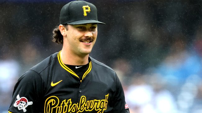 Pittsburgh Pirates starting pitcher Paul Skenes smiles as he walks off the field