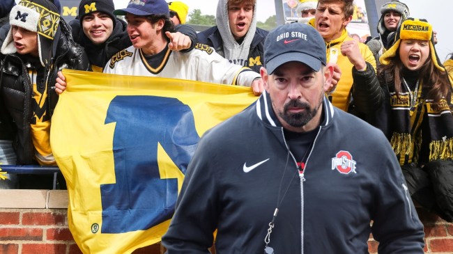 Ohio State football coach Ryan Day over a background of Michigan fans.