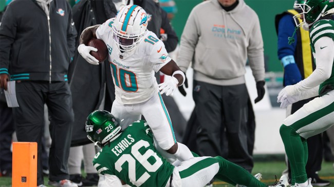 Tyreek Hill of the Miami Dolphins runs the ball against the New York Jets