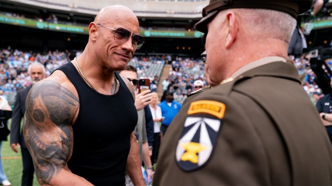 UFL owner Dwayne Johnson The Rock shakes hand with military service men and women