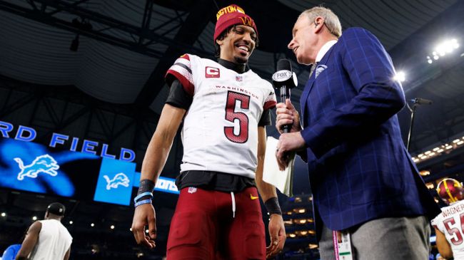 jayden daniels doing an interview on the field