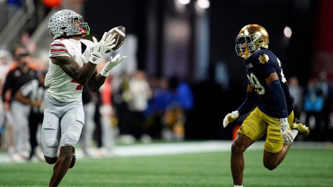 Ohio State WR Jeremiah Smith catches a pass over a Notre Dame defender.