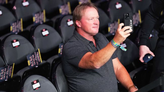 jon gruden holding up cell phone