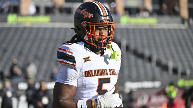 Oklahoma State defender Kendal Daniels warms up before a game.