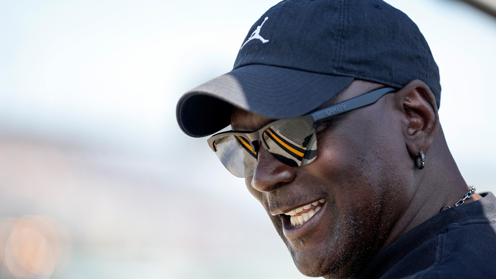 Michael Jordan wearing sunglasses and a hat 