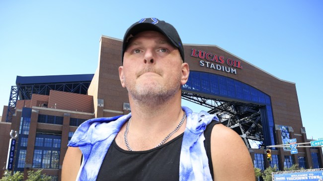 Pat McAfee pictured over a background of Lucas Oil Stadium.