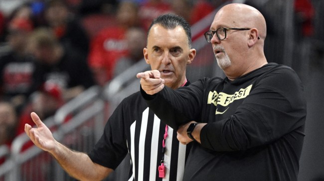 Wake Forest basketball coach Steve Forbes chats with an official during a game vs. Louisville.