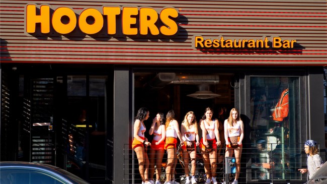 Hooters waitresses on balcony at restaurant