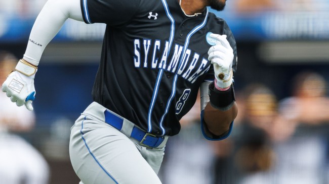 An Indiana State baseball player rounds first base.