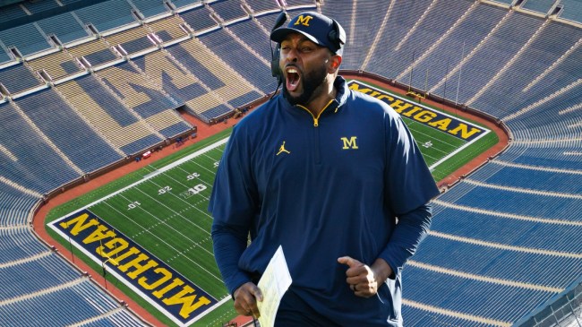 Michigan football coach Sherrone Moore celebrates.