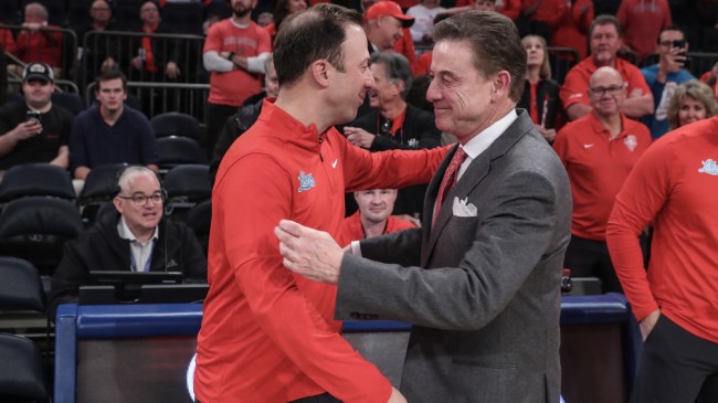 St. John's basketball coach Rick Pitino greets his son, Richard, before a game vs. New Mexico.