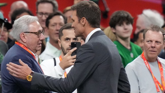 Tom Brady and Sal Paolantonio shake hands before Super Bowl LIX