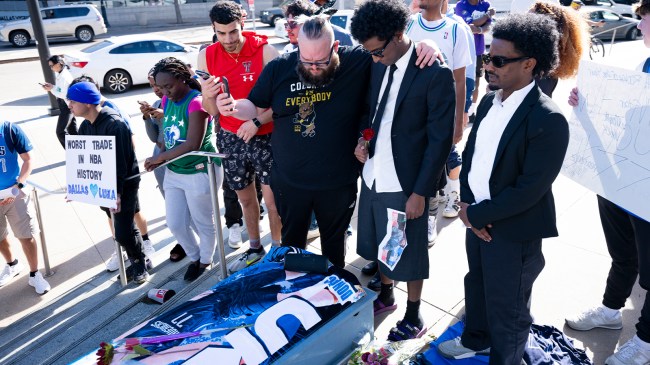 Mavericks fans next to coffin during mock funeral for Luka Doncic