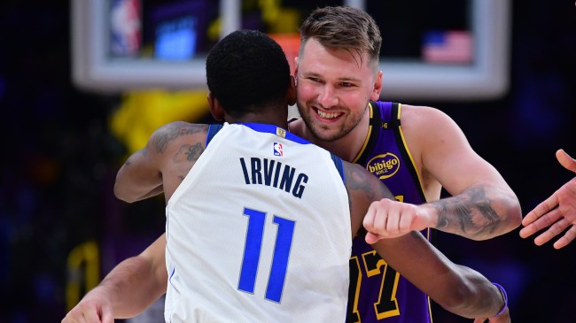 Feb 25, 2025; Los Angeles, California, USA; Los Angeles Lakers guard Luka Doncic (77) reacts with Dallas Mavericks guard Kyrie Irving (11) during the first quarter at Crypto.com Arena. Mandatory Credit: Gary A. Vasquez-Imagn Images