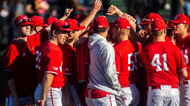 The Nebraska baseball team breaks a huddle.