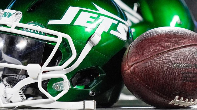 New York Jets helmet next to football