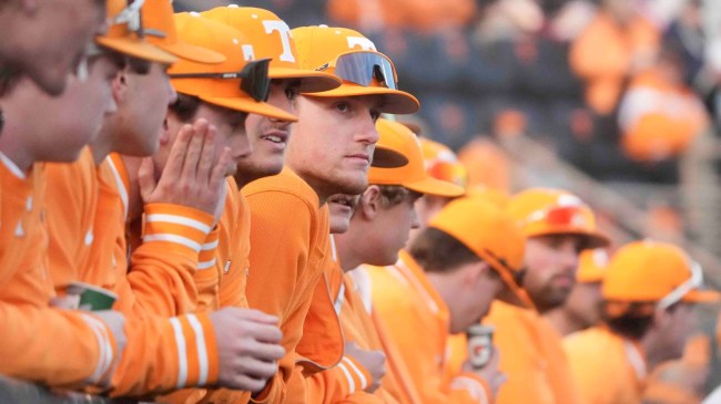 Tennessee baseball players watch from the dugout.