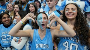 North Carolina basketball fans cheer in the stands.