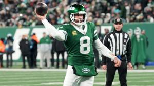 New York Jets quarterback Aaron Rodgers (8) throws his 500th career touchdown pass in the second quarter of the game against the Miami Dolphins on Jan. 5, 2025, in East Rutherford, N.J.