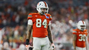 Miami tight end Cam McCormick lines up on the field.