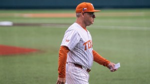 Texas baseball coach David Pierce walks onto the field.