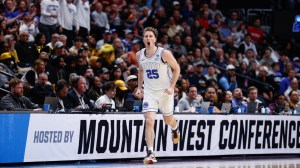 BYU basketball player Dawson Baker runs on the court.