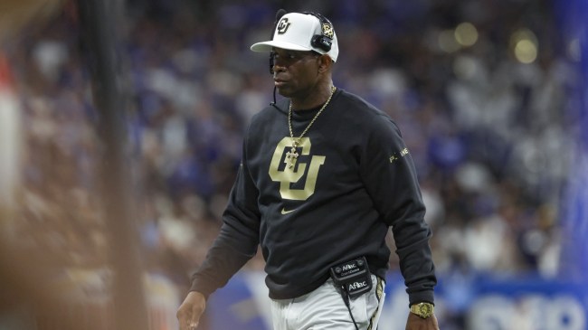 Colorado football coach Deion Sanders on the field.