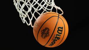 Basketball with Final Four logo going through net