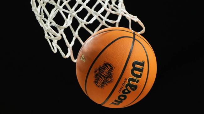 Basketball with Final Four logo going through net